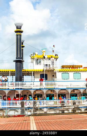 NEW ORLEANS - JULY 16, 2013: people at the creole Queen steam boat in New Orleans, USA. Constructed in Moss Point, Mississippi, the Creole Queen took Stock Photo