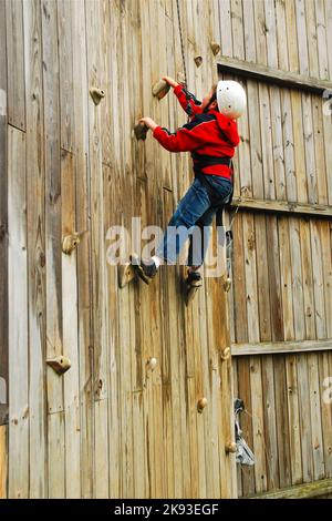 6 year old boy shows bravery and determination while climbing at