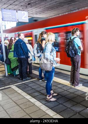 Prague Spring Event People enter a subway station during rain in Santiago, Chile, Tuesday ...