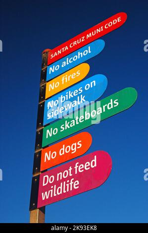 A colorful sign reminds visitors of the rules, regulations and municipal codes of Santa Monica and the Boardwalk area Stock Photo