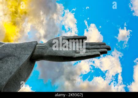 Rio de Janeiro, Brazil - January 30, 2015: hand of Christ the Redeemer statue, created by French sculptor Paul Landowski at top the Corcovado Mountain Stock Photo