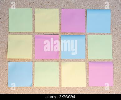 Blank colorful sticky notes on a notice board Stock Photo
