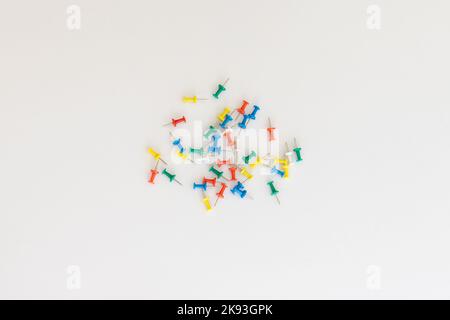 Push pins of different colors on a white isolated background Stock Photo