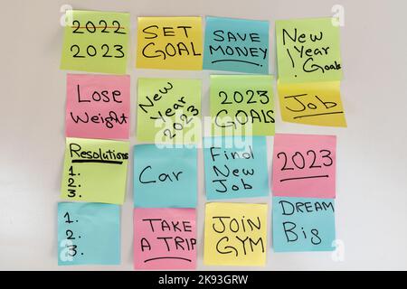 New year 2023 resolutions and goals written on a sticky notes on a white isolated background Stock Photo