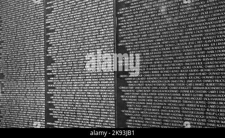 WASH DC -JULY 14: Names of Vietnam war casualties on Vietnam War Veterans Memorial on July 14,2010 in Washington DC, USA. Names in chronological order Stock Photo