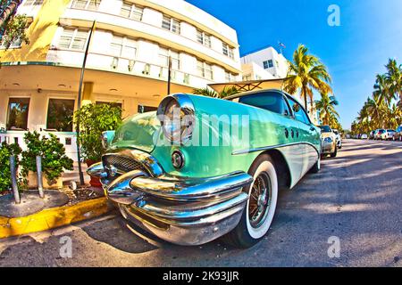 MIAMI BEACH, USA - AUGUST 02: midday view at Ocean drive on August 02,2010 in Miami Beach, Florida. The old Buick from 1954 stands as attraction in fr Stock Photo