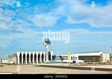 Frankfurt, Germany - August 25, 2010: maintenance hall and the tower of german air traffic control in Frankfurt, Germany. Frankfurt Airport is the bus Stock Photo