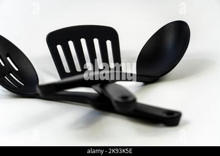 black plastic kitchen utensils isolated on white. Clipping path included. mexico Stock Photo