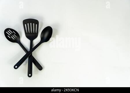 black plastic kitchen utensils isolated on white. Clipping path included. mexico Stock Photo