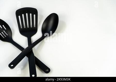 black plastic kitchen utensils isolated on white. Clipping path included. mexico Stock Photo