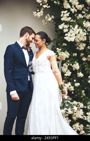 Were meant for each other. a happy newlywed young couple posing together on their wedding day. Stock Photo