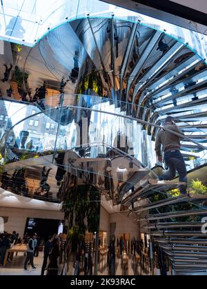 The spiral staircase at the Fifth Avenue Apple Store, the flagship in New York City.  Photo by Francis Specker Stock Photo