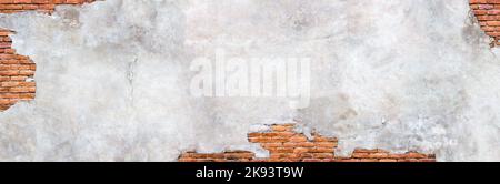 Damaged plaster wall background. Antique brick wall under concrete texture. Stock Photo