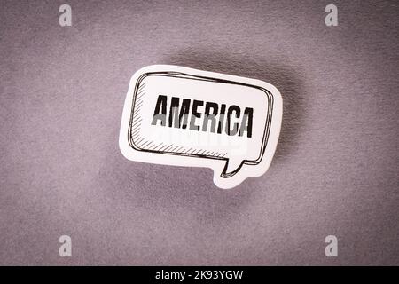 AMERICA. Speech bubble with text on gray background. Stock Photo