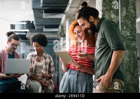 Programmers cooperating at IT company developing apps. People business work office concept Stock Photo