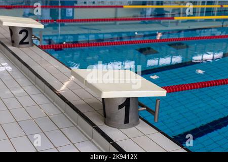 Starting block on a pool basin Stock Photo