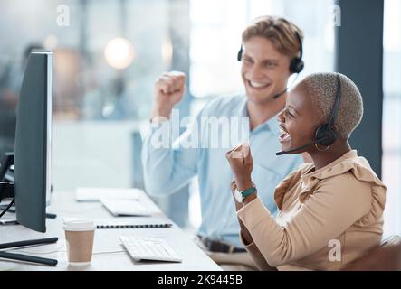 Call center, success and employees in celebration, consulting and working with a goal, support and motivation on a computer. Excited, winning and Stock Photo