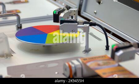 Polygraphy printing concept. Rotating wheel palette. Working machinery equipment. Stock Photo