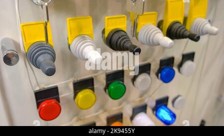 Multi-colored buttons. Production line control panel. Manufacturing and electricity concept. Stock Photo