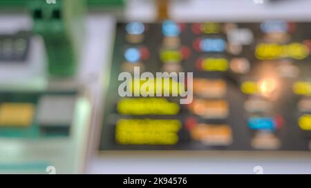 Blurred digital panel board with blinking screen. Defocused graphic technology display. Stock Photo