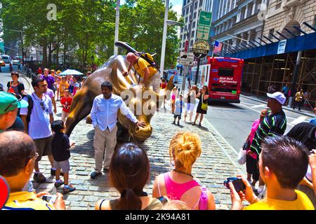 NEW YORK CITY - JULY 09: The landmark Charging Bull in Lower Manhattan represents the strength and power of the American People July 09, 2010 in New Y Stock Photo