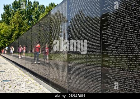 WASH DC -JULY 14: Names of Vietnam war casualties on Vietnam War Veterans Memorial on July 14,2010 in Washington DC, USA. Names in chronological order Stock Photo