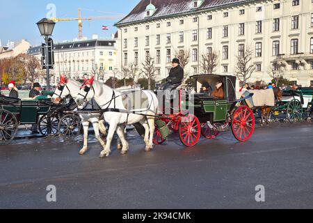 VIENNA, AUSTRIA - NOV 26: Traditional coach (Fiaker) today traveling tourists on NOV 26, 2010 in Vienna, Austria. Stock Photo