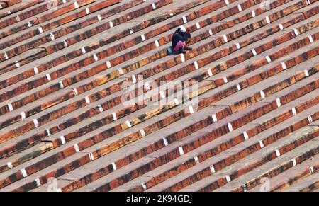 Delhi, India - November 9, 2011:  pilgrims rests at the stairs of Jama Masjid Mosque in Delhi, india. It is the largest and best-known mosque in India Stock Photo