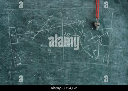 soccer tactics scribble on blackboard and whistle of soccer referee or trainer. Great soccer event this year, soccer championship concept. Stock Photo