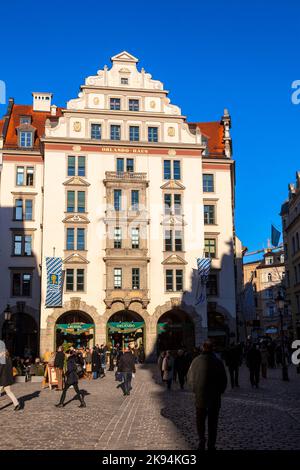 MUNICH, GERMANY - DEC 27, 2011: people walk along the street towards on DEC 27,2011 in Munich, Germany. The old town hall was in operation until 1874 Stock Photo