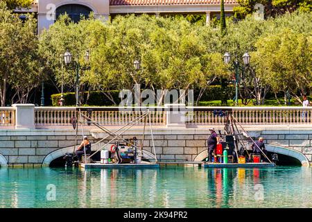 LAS VEGAS NV - JUNE 15: divers clean the lake of Luxury hotel Bellagio on June 15, 2012 in Las Vegas, USA.  The Bellagio opened October 15, 1998. Stock Photo