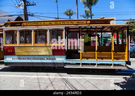 SAN FRANCISCO - JUNE 20: Famous Cable Car Bus in Powell and Mason street on June 20, 2012 in San Francisco, California. Cable car trains first began o Stock Photo