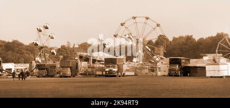 Vintage Liverpool 1968, fairground in a local park. Sepia image, Coarse grain effect. Stock Photo