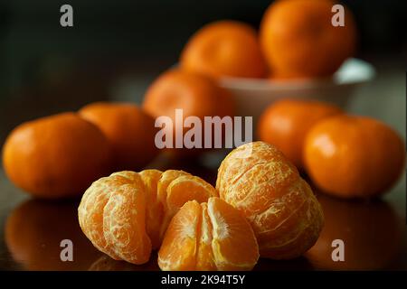 Orange Fruit slices on a brown table Stock Photo