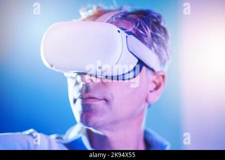 Virtual reality, digital and man in metaverse for future or 3d futuristic simulation technology in a studio. Innovation, cyber and mature person Stock Photo