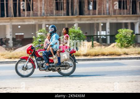 RAJASTHAN - INDIA - OCTOBER 17: Father with two children on scooter through busy highway street on October 17, 2012 in Rajasthan, India. Up to six fam Stock Photo