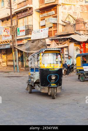 JODHPUR, INDIA - OCT 23: Auto rickshaw taxi driver on October 23,2012 in Jodhpur, India. These iconic taxis have recently been fitted with CNG powered Stock Photo