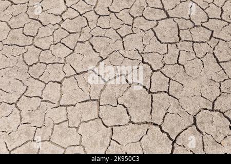 Dry cracked ground in a dried up lake Stock Photo