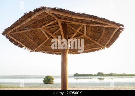 Under the palapa with blue sky. Stock Photo
