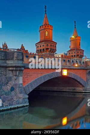 Oberbaum Bridge, double-deck bridge crossing Berlin's River Spree in the early morning, Friedrichshain-Kreuzberg district, Germany, Berlin Stock Photo