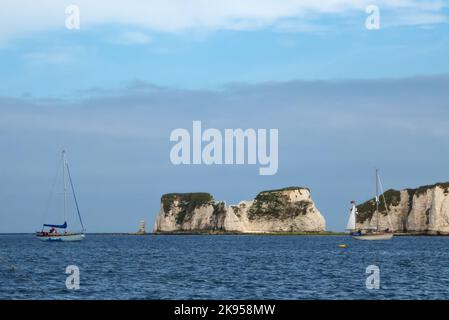 At anchor in Studland Bay, Dorset England,UK, with Great Harry Rocks beyond. Stock Photo