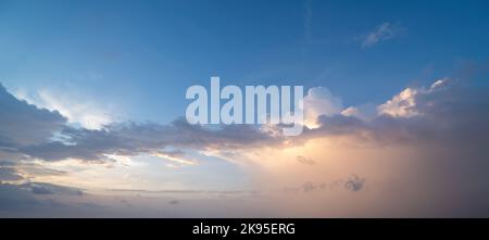Beautiful sunset sky with some clouds during summer on a nice day Stock Photo