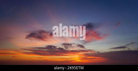 Beautiful sunset sky with some clouds during summer on a nice day Stock Photo
