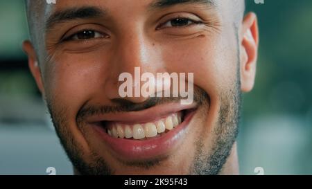 Close up head shot male portrait cheerful glad carefree smiling African Latina guy man client businessman healthy bearded boss entrepreneur model with Stock Photo