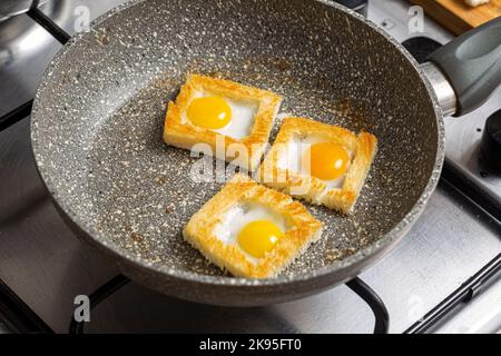 Quail egg sandwiches in the stone frying pan Stock Photo