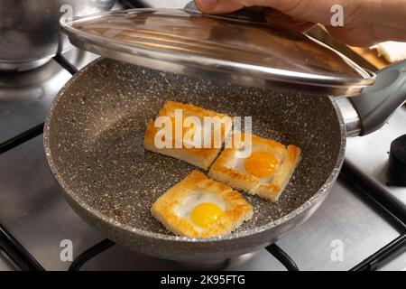Quail egg sandwiches in the stone frying pan Stock Photo