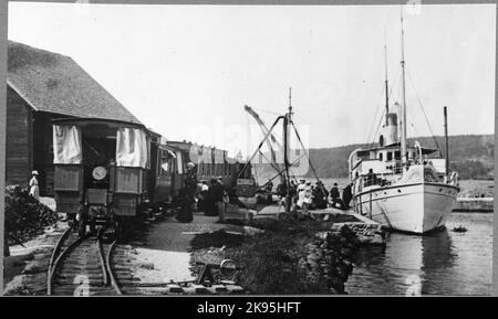 Passenger trains with summer cars at Hästholmen harbor. Stock Photo