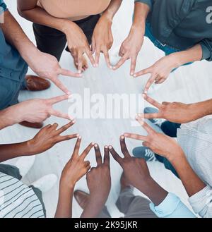 Teamwork, peace hand sign together and corporate support of a worker team showing community. Business collaboration, solidarity and company trust Stock Photo