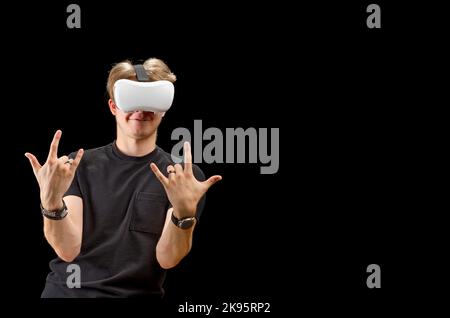 Portrait of a young man with 3D virtual reality glasses. Young man using vr headset, VR goggles Stock Photo