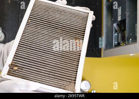 Replacing filter in the central ventilation system. hvac filter replacing home central air system Stock Photo